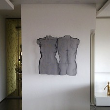 nude pair as wall-mounted art