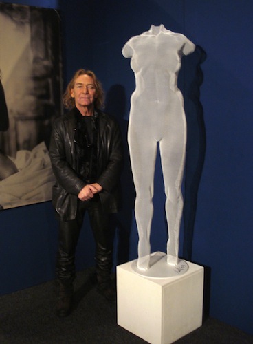 artist David Begbie with sculpture of a nude female figure in wired mesh