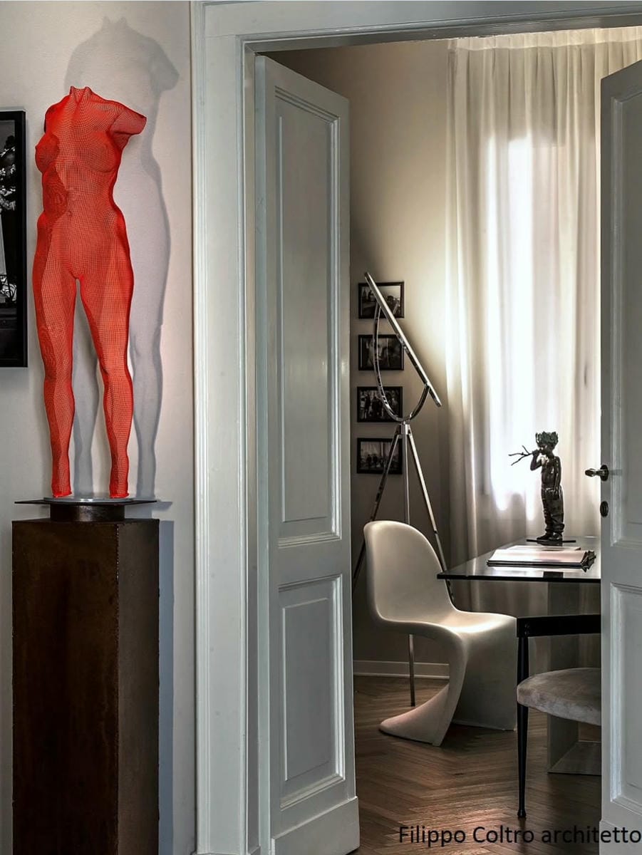 A black-painted steel frame as a suspension solution for a floating sculpture