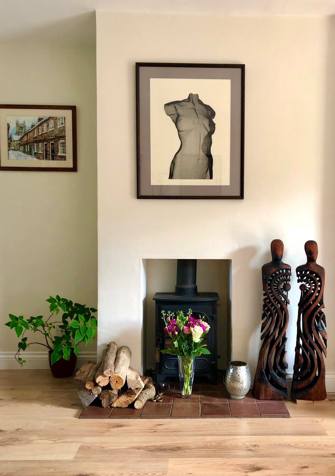 A stylish fireplace with a David Begbie etching and Walter Bailey sculptures