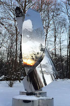 winter sun reflecting in garden sculpture