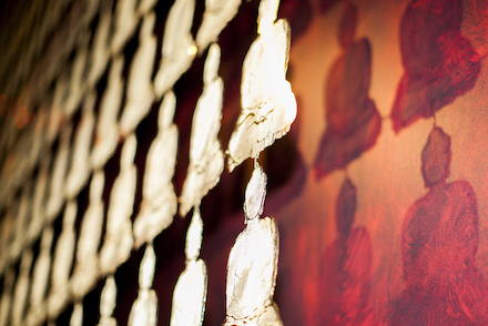 buddha brass artwork detail shadow projections