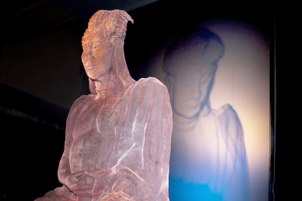 buddhasculpture shadow on frosted glass