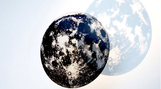 Our moon as a floating steel sculpture