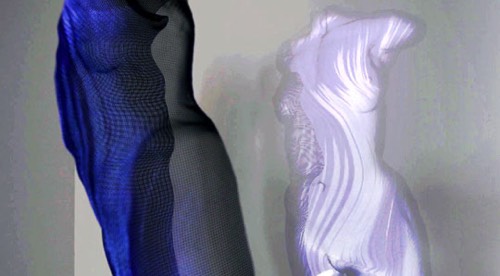 Blue light lights a modern sculpture projecting lively shadows