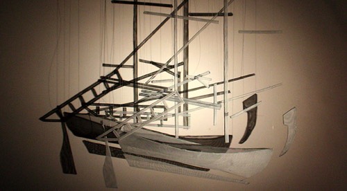 sculpture of a wiremesh boat with shadows